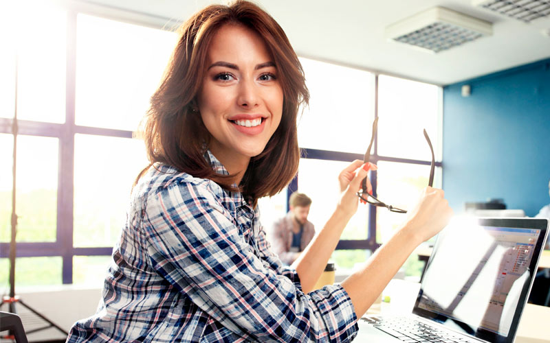 Photo woman working with new startup project in modern loft. Generic design notebook on wood table.